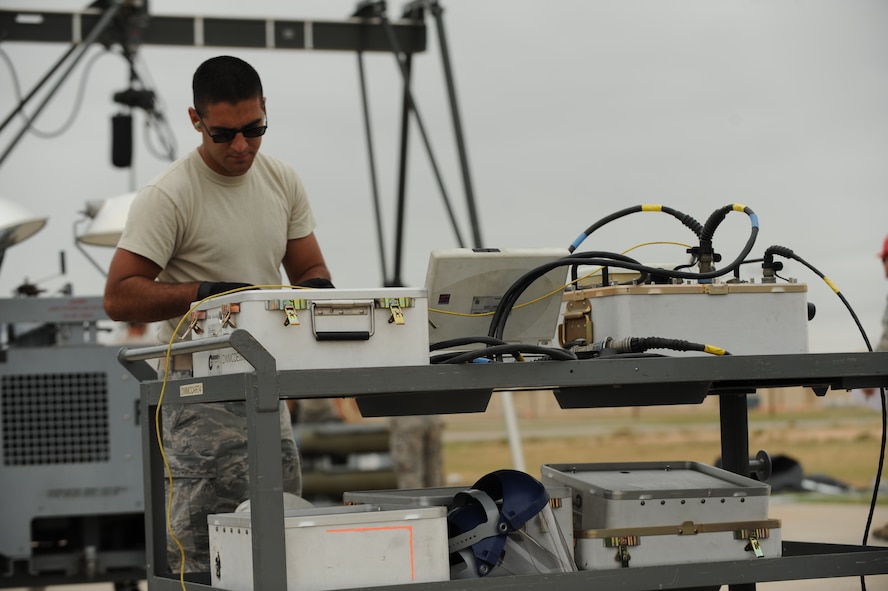 U.S. Air Force Airman 1st Class Brian Oldham, conventional munitions maintenance technician, 7th Munitions Squadron, tests tail kits for functionality during the Global Strike Challenge Sept. 11, 2014, at Dyess Air Force Base, Texas. Fifteen inert bomb units were constructed during this portion of the competition and were loaded onto a B-1B Lancer later in the day during the load challenge. (U.S. Air Force photo by 2nd Lt. Lauren Linscott/Released)