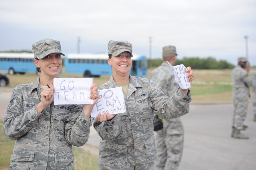 U.S. Air Force Tech. Sgt. Heather Roth, left, munitions operations section assistant noncommissioned officer in charge, and Tech. Sgt. Stacy Shoemaker, munitions support equipment supervisor, both from the 7th Munitions Squadron, show support for Team Dyess during the Global Strike Challenge Sept. 11, 2014, at Dyess Air Force Base, Texas. The Global Strike Challenge is a competition to identify the best operations, maintenance and security forces personnel and units performing the Global Strike mission. Results from the competition will be released Nov. 4-5. (U.S. Air Force photo by 2nd Lt. Lauren Linscott/Released)