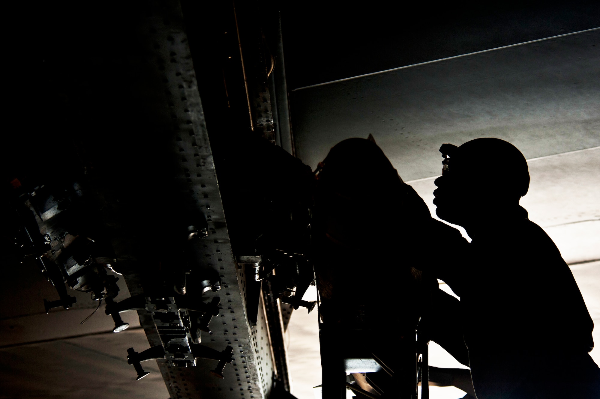 Staff Sgt. Kelvin McCrea, 5th Aircraft Maintenance Squadron weapons load crew member, loads a joint direct attack GBU-38 munition on a B-52H Stratofortress on Minot Air Force Base, N.D., Sept. 5, 2014. McCrea is a part of the weapons load crew competing in the 2014 Global Strike Challenge. (U.S. Air Force photo/Senior Airman Brittany Y. Bateman)