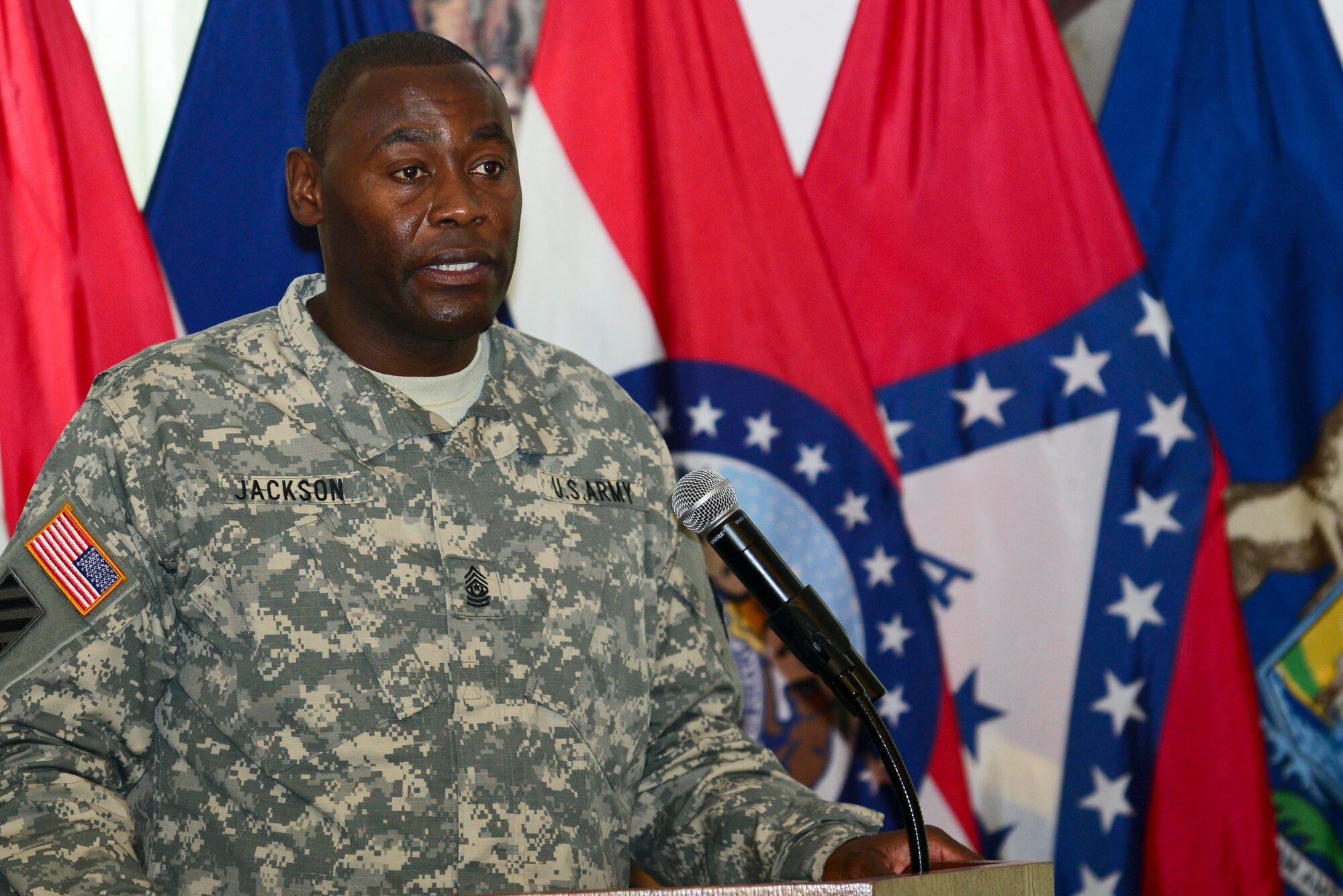 U.S. Army Sgt. Maj. James Jackson, 733rd Mission Support Group command sergeant major, speaks to a crowd during a change of responsibility at Fort Eustis, Va., Sept. 12, 2014. Jackson assumed responsibility from Sgt. Maj. Jesse Sharpe. (U.S. Air Force photo by Airman 1st Class Kimberly Nagle/Released)