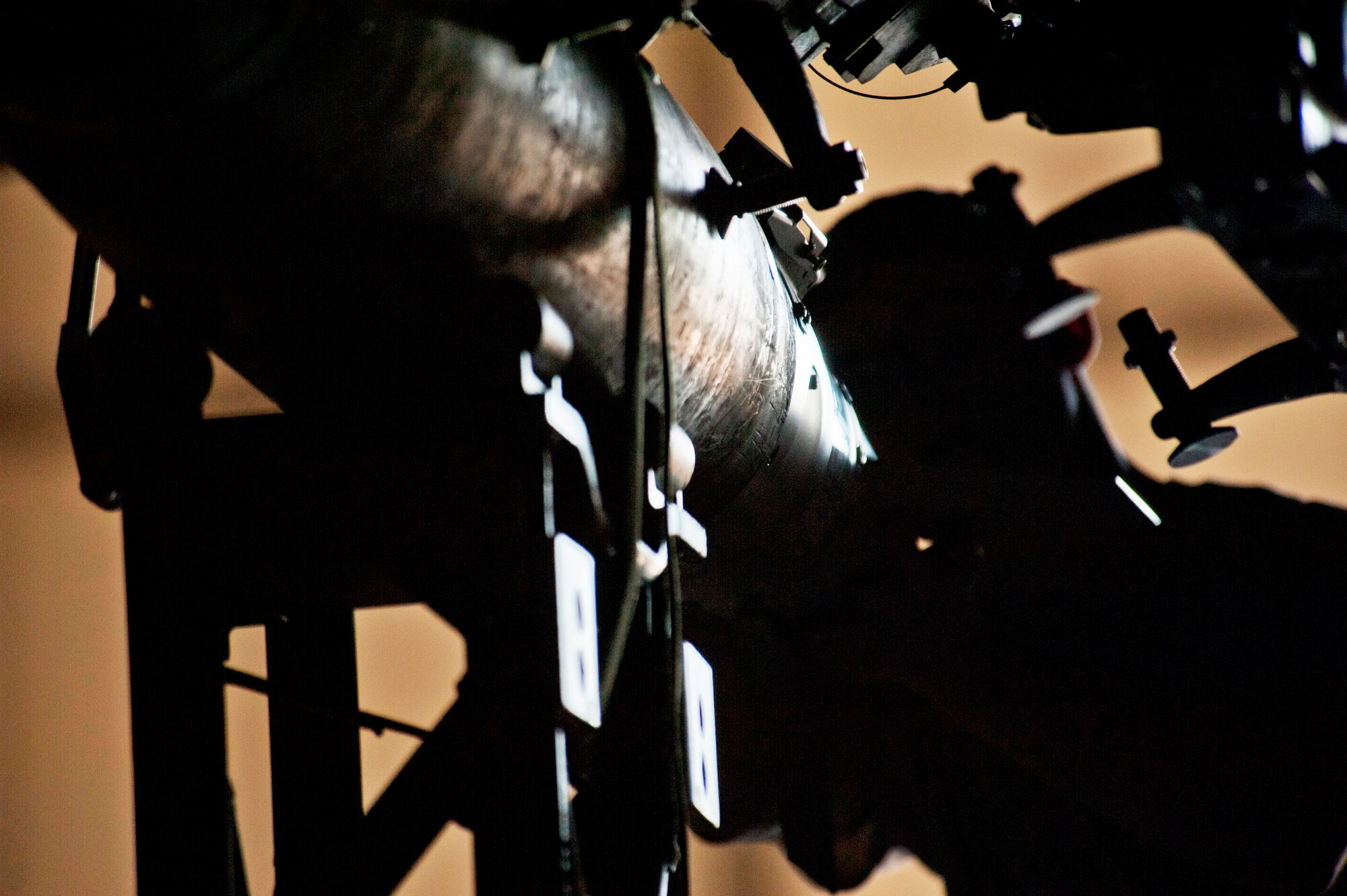 Senior Airman Andrew Grimes, 5th Aircraft Maintenance Squadron weapons load crew member, loads a joint direct attack GBU-38 munition on a B-52H Stratofortress on Minot Air Force Base, N.D., Sept. 5, 2014. The load crew is evaluated on how quickly they load munitions on a B-52 and how many discrepancies are found. (U.S. Air Force photo/Senior Airman Brittany Y. Bateman)