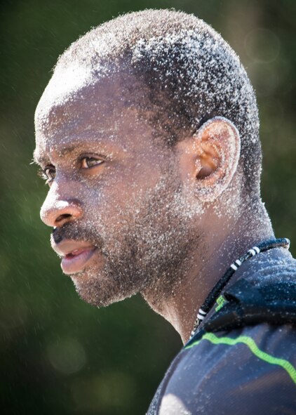 Rollin Vickers waits for the waterhose to wash the sand off his face during the GORUCK Cohesion Challenge Sept. 11, at Eglin Air Force Base, Fla.  This elite team-building event, led by a Special Forces veteran, featured military inspired challenges and missions.  Only 24 out of the original 27 completed all obstacles.  Eglin is the fifth base to complete the Team Cohesion Challenge, which is modeled after special operations training.  (U.S. Air Force photo/Tech. Sgt. Jasmin Taylor)