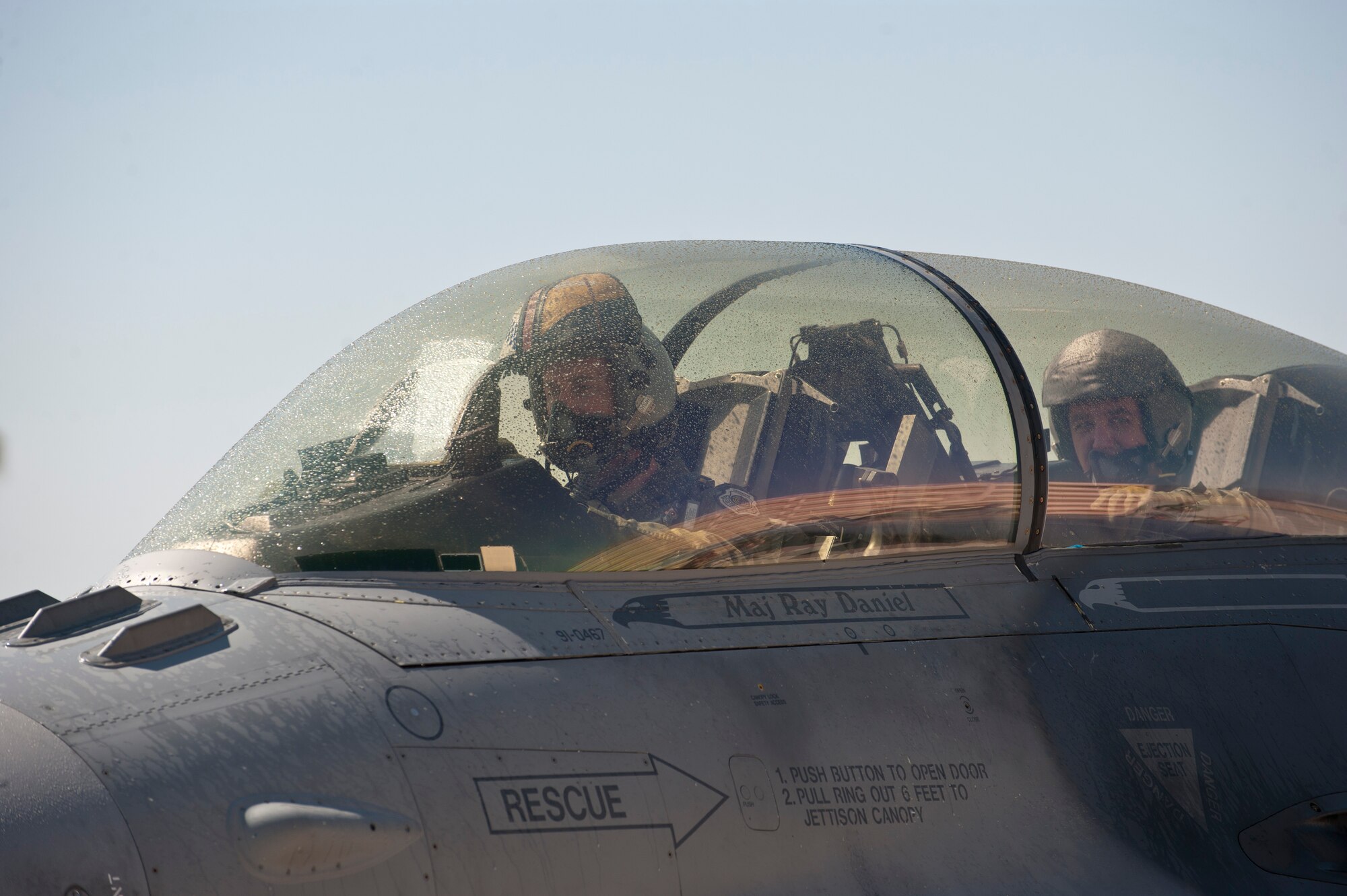 An F-16 Fighting Falcon piloted by Lt. Gen. Burton M. Field (right) and Lt. Col. David Epperson taxis after landing from Field’s final Air Force sortie, or “fini” flight, at Nellis Air Force Base, Nev., Sept. 11, 2014. Field, who first came to Nellis in 1981 as an F-16 pilot in the 430th Tactical Fighter Squadron, chose to do his final flight at Nellis during a four-day visit to the base to see the missions of Red Flag, the Combined Air and Space Operations Center, U.S. Air Force Warfare Center, U.S. Air Force Weapons School, and the Nevada Test and Training Range. Field is the deputy chief of staff of Operations, Plans and Requirements, Headquarters U.S. Air Force, Washington, D.C., and Epperson is the 16th Weapons Squadron commander. (U.S. Air Force photo by Airman 1st Class Thomas Spangler)