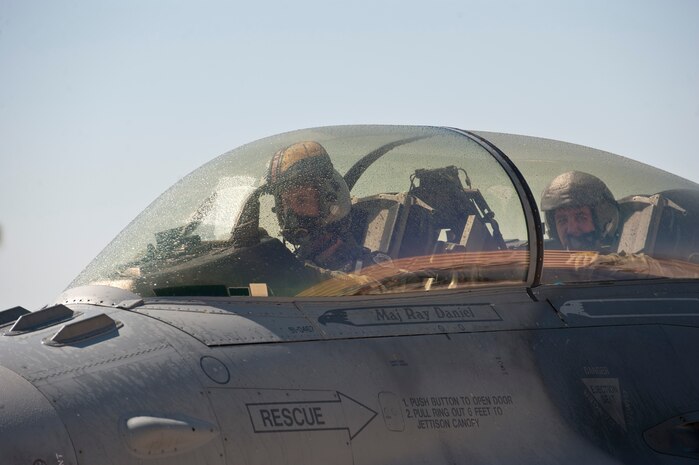 An F-16 Fighting Falcon piloted by Lt. Gen. Burton M. Field (right) and Lt. Col. David Epperson taxis after landing from Field’s final Air Force sortie, or “fini” flight, at Nellis Air Force Base, Nev., Sept. 11, 2014. Field, who first came to Nellis in 1981 as an F-16 pilot in the 430th Tactical Fighter Squadron, chose to do his final flight at Nellis during a four-day visit to the base to see the missions of Red Flag, the Combined Air and Space Operations Center, U.S. Air Force Warfare Center, U.S. Air Force Weapons School, and the Nevada Test and Training Range. Field is the deputy chief of staff of Operations, Plans and Requirements, Headquarters U.S. Air Force, Washington, D.C., and Epperson is the 16th Weapons Squadron commander. (U.S. Air Force photo by Airman 1st Class Thomas Spangler)