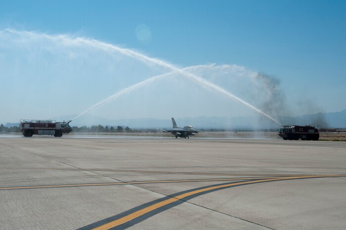An F-16 Fighting Falcon piloted by Lt. Gen. Burton M. Field and Lt. Col. David Epperson taxis after landing from Field’s final Air Force sortie, or “fini” flight, at Nellis Air Force Base, Nev., Sept. 11, 2014. Field served multiple assignments at Nellis throughout his 35-year career, including serving as the commandant of the U.S. Air Force Weapons School from 2000 to 2001, and was visiting the base to get a first-hand look at Nellis’ multiple missions. Field is the deputy chief of staff of Operations, Plans and Requirements, Headquarters U.S. Air Force, Washington, D.C., and Epperson is the 16th Weapons Squadron commander. (U.S. Air Force photo by Staff Sgt. Veronica Sneed)