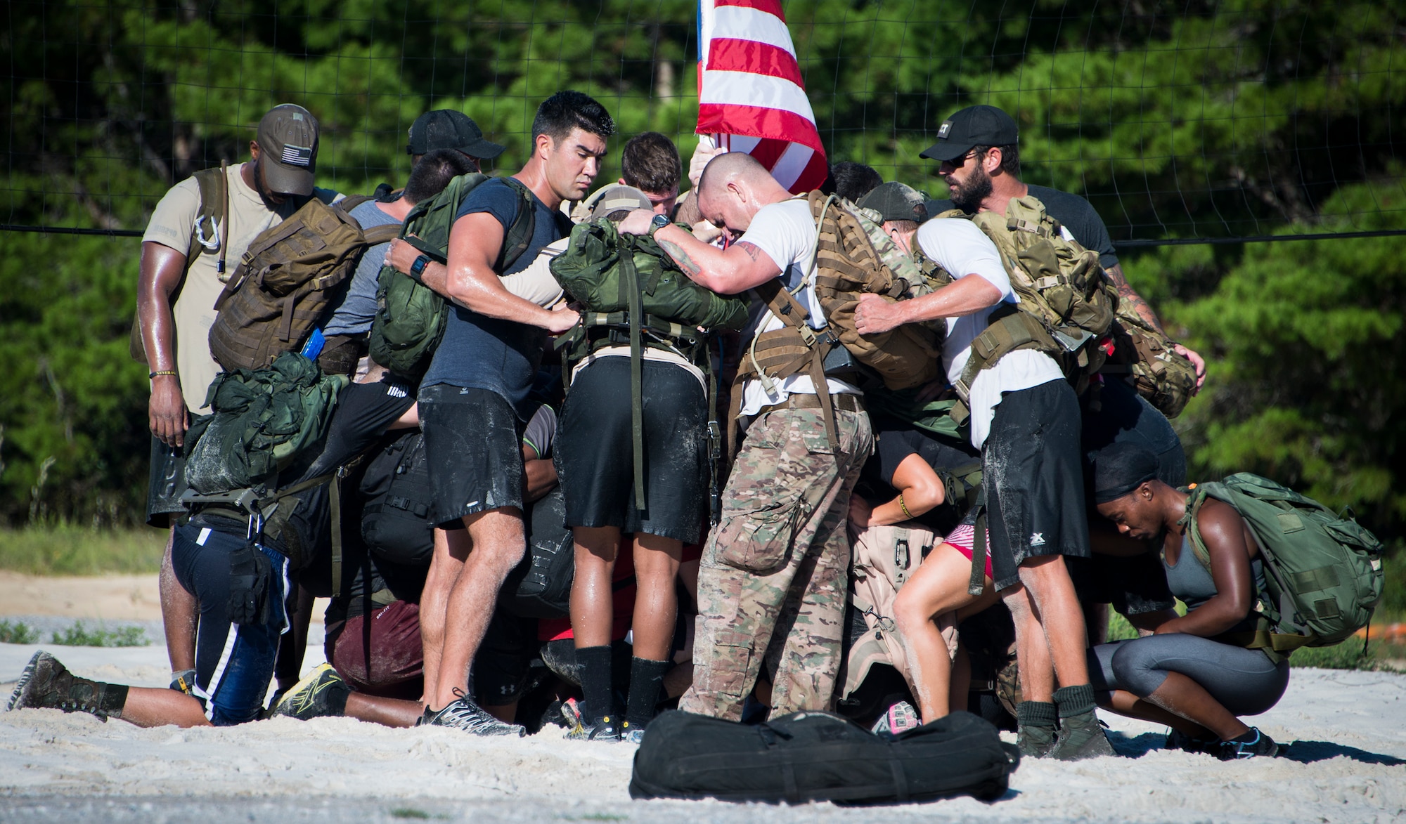 Members break for a moment of silence to remember the fallen during the GORUCK Cohesion Challenge Sept. 11, at Eglin Air Force Base, Fla.  This elite team-building event, led by a Special Forces veteran, featured military inspired challenges and missions.  Only 24 out of the original 27 completed all obstacles.  Eglin is the fifth base to complete the Team Cohesion Challenge.  (U.S. Air Force photo/Tech. Sgt. Jasmin Taylor)