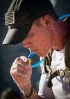 Colten Ederer hydrates during the GORUCK Cohesion Challenge Sept. 11, at Eglin Air Force Base, Fla.  This elite team-building event, led by a Special Forces veteran, featured military inspired challenges and missions.  Only 24 out of the original 27 completed all obstacles.  Eglin is the fifth base to complete the Team Cohesion Challenge.  (U.S. Air Force photo/Tech. Sgt. Jasmin Taylor)