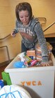 VANCE AIR FORCE BASE, Okla. -- Staff Sgt. Nichole Curran, the 71st Weather Flight NCO in-charge and an Enlisted Spouses Group member, loads a donation box at the Enid, Oklahoma, Young Women’s Christian Association Sept. 12. Members of the ESG gathered donations of clothing, towels, blankets, soaps, feminine products, dental care items, laundry detergent and dish soap. The items gathered were from a list provided by the YWCA of the most-needed products. The YWCA provides shelter for women coming out of abusive relationships as they settle into homes and offers confidence-building programs. (U.S. Air Force photo/Senior Airman Frank Casciotta)