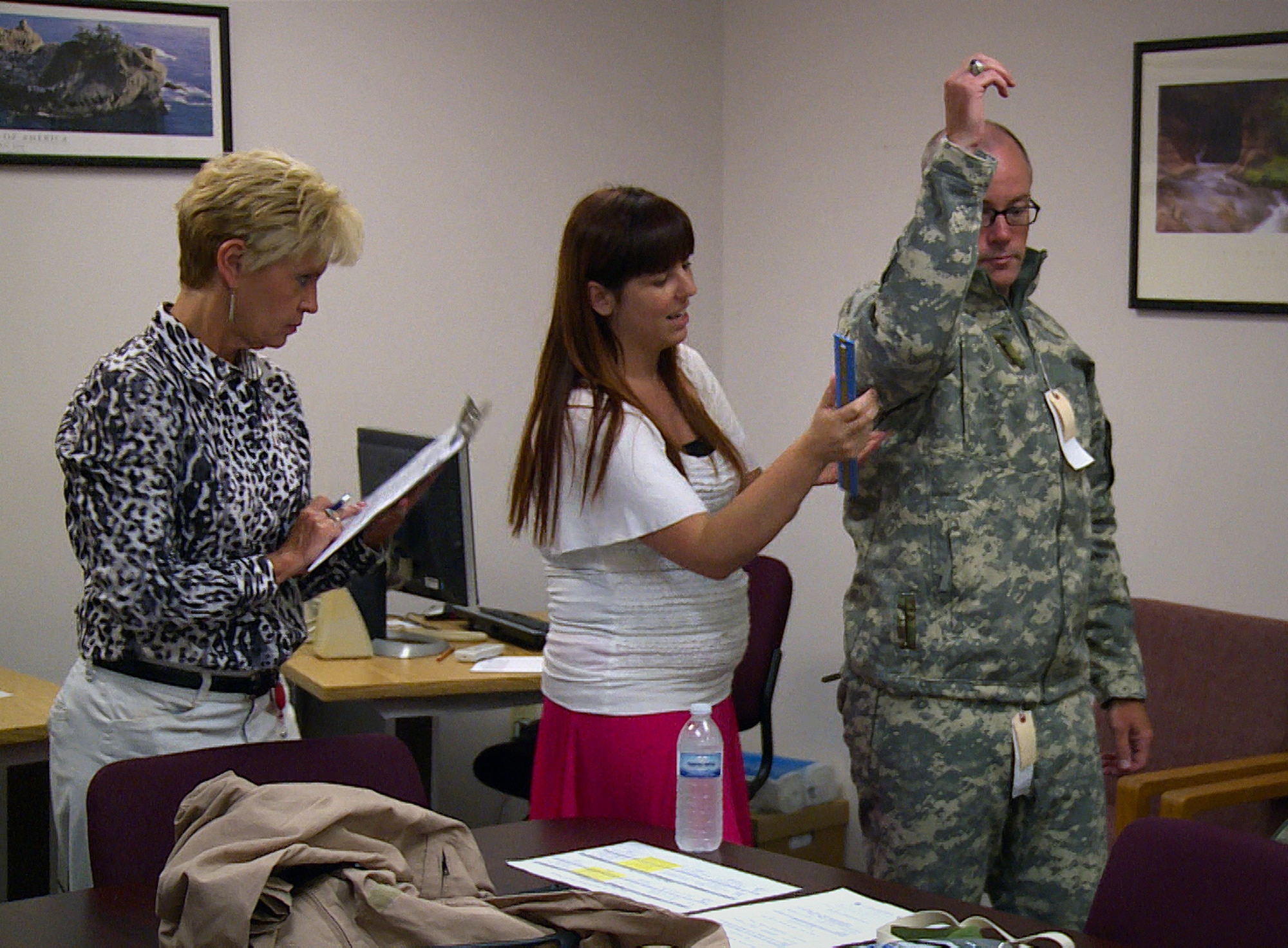 WRIGHT-PATTERSON AIR FORCE BASE, Ohio -- Kristina Dodds (left) and
Andrea Pardue fit tests an Airman trying on the new Cold Weather Aviation
System. The request is to develop a flame resistant system that can also
keep aircrews warm in minus 20 degree temperatures with a 55 mile an hour
wind. Kristina and Andrea are clothing designers in the Air Force Uniform
Office at Wright-Patterson AFB, Oh. (U.S. Air Force photo by Matthew Clouse,
88th ABW Public Affairs.)(Released)
