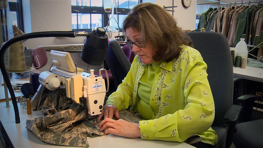 Debra Klensch sews pockets on an Airman Battle Uniform. Klensch is a clothing designer in the Air Force Uniform Office at Wright-Patterson Air Force Base, Ohio. The AFUO is an integrated product team of designers and engineers within the Human Systems Division here that works together to develop patterns, create prototypes, and manage fit and wear tests for more than 520 individual items. (U.S. Air Force photo/Matthew Clouse) 