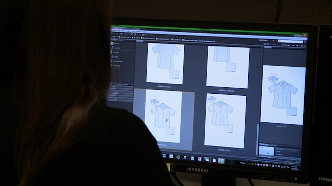 Stacey Butler, a clothing designer in the Air Force Uniform Office at Wright-Patterson AFB, Ohio, designs a uniform at her desk. The AFUO is an integrated product team of designers and engineers within the Human Systems Division here that works together to develop patterns, create prototypes, and manage fit and wear tests for more than 520 individual items. (U.S. Air Force photo/Matthew Clouse)