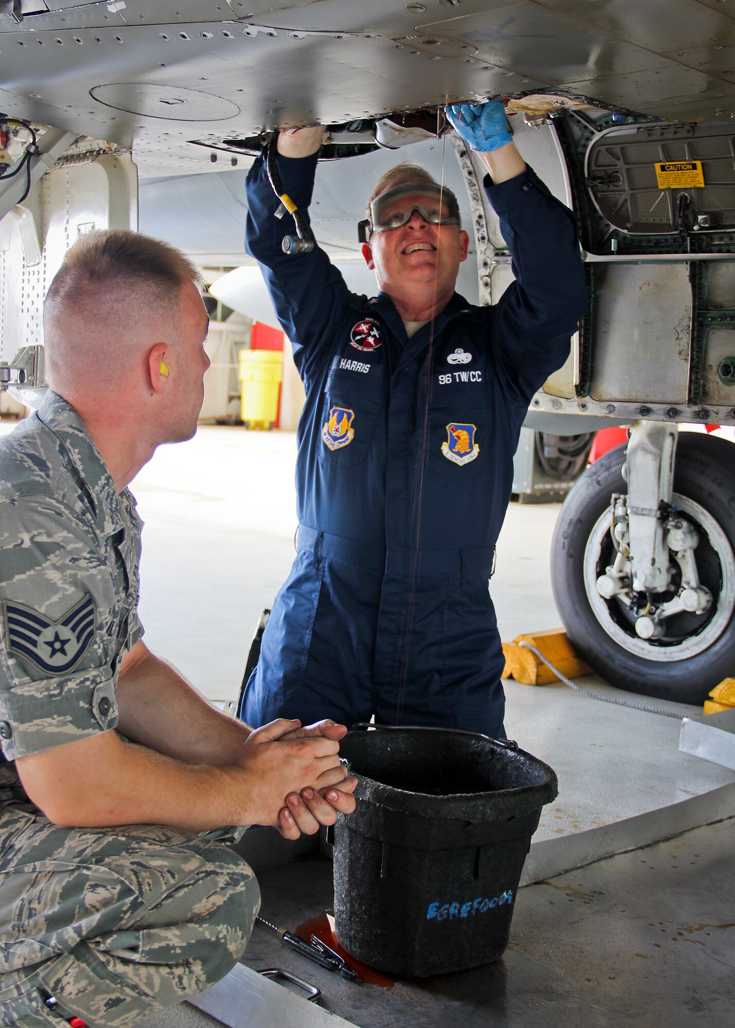 Brig. Gen. David Harris, 96th Test Wing commander, and Staff Sgt. Philip Bulavko perform maintenance on an F-15 Eagle Sept. 15 at Eglin Air Force Base, Fla.  (Courtesy photo) 
