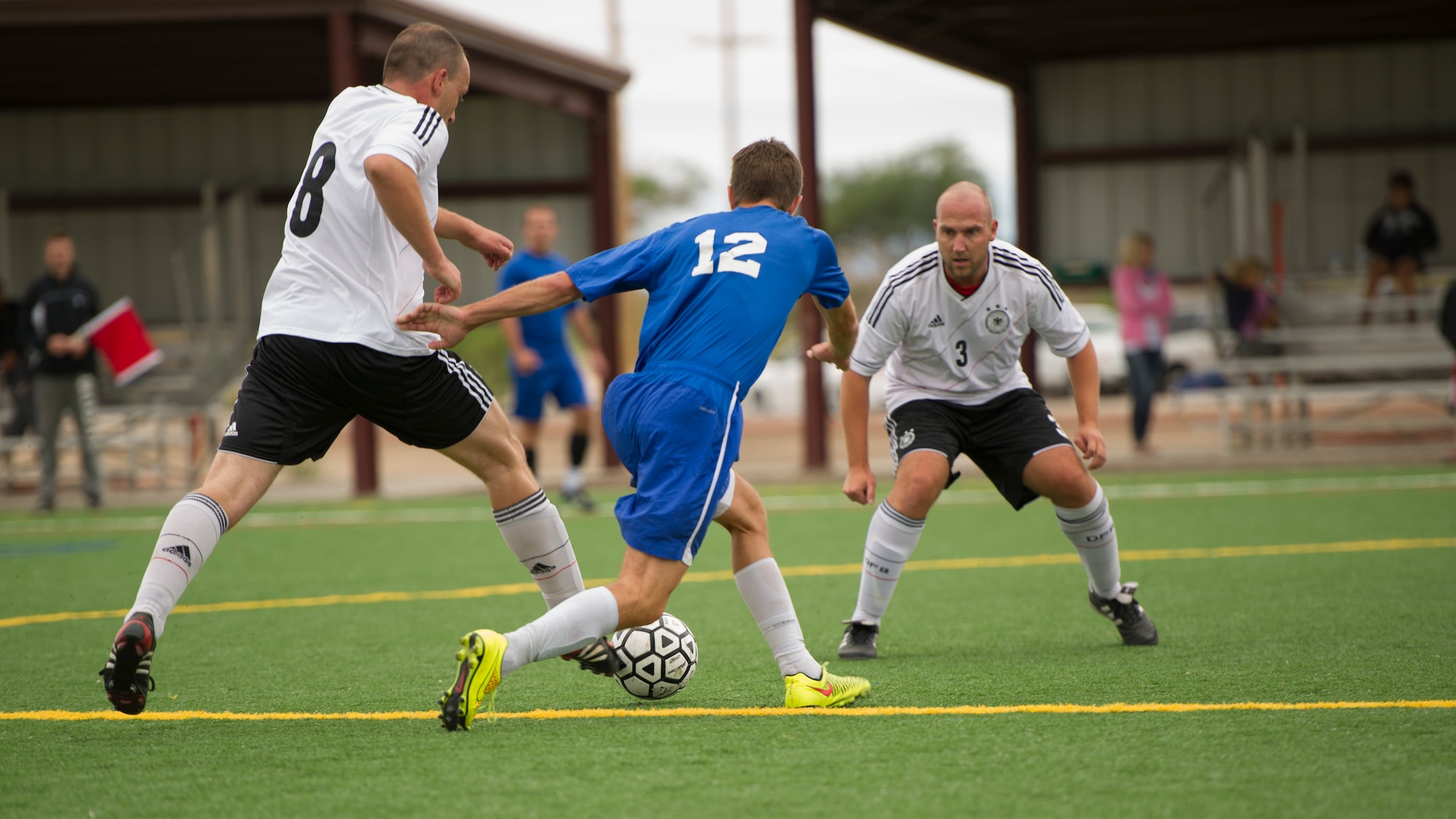 Members of Team Holloman battle for the ball during the annual Oktoberfest International Soccer Match at Holloman Air Force Base, N.M., Sept. 13. Every year the United States Air Force and the German Air Force compete in a soccer match before the Oktoberfest celebration begins. (U.S. Air Force photo by Airman 1st Class Chase Cannon / Released)