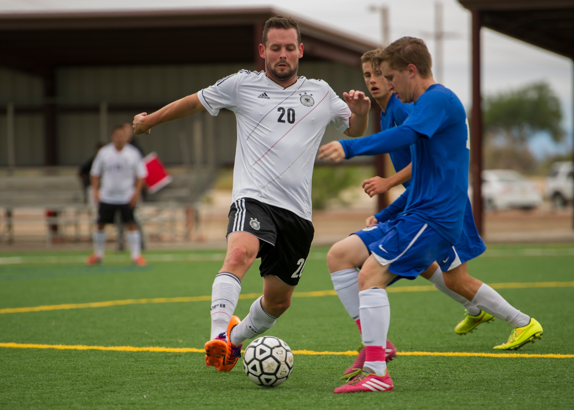 Members of Team Holloman battle for the ball during the annual Oktoberfest International Soccer Match at Holloman Air Force Base, N.M., Sept. 13. Every year the United States Air Force and the German Air Force compete in a soccer match before the Oktoberfest celebration begins. (U.S. Air Force photo by Airman 1st Class Chase Cannon / Released)