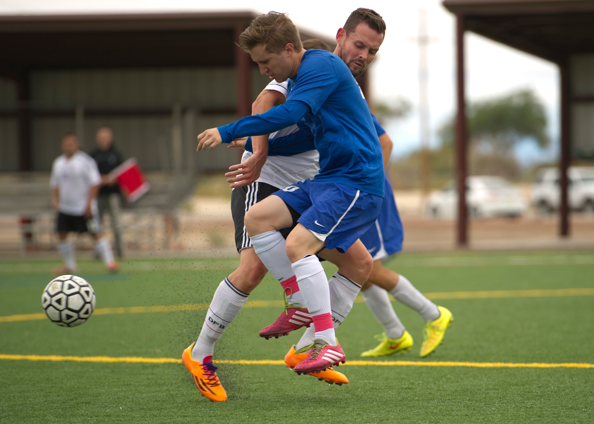 Members of Team Holloman battle for the ball during the annual Oktoberfest International Soccer Match at Holloman Air Force Base, N.M., Sept. 13. Every year the United States Air Force and the German Air Force compete in a soccer match before the Oktoberfest celebration begins. (U.S. Air Force photo by Airman 1st Class Chase Cannon / Released)