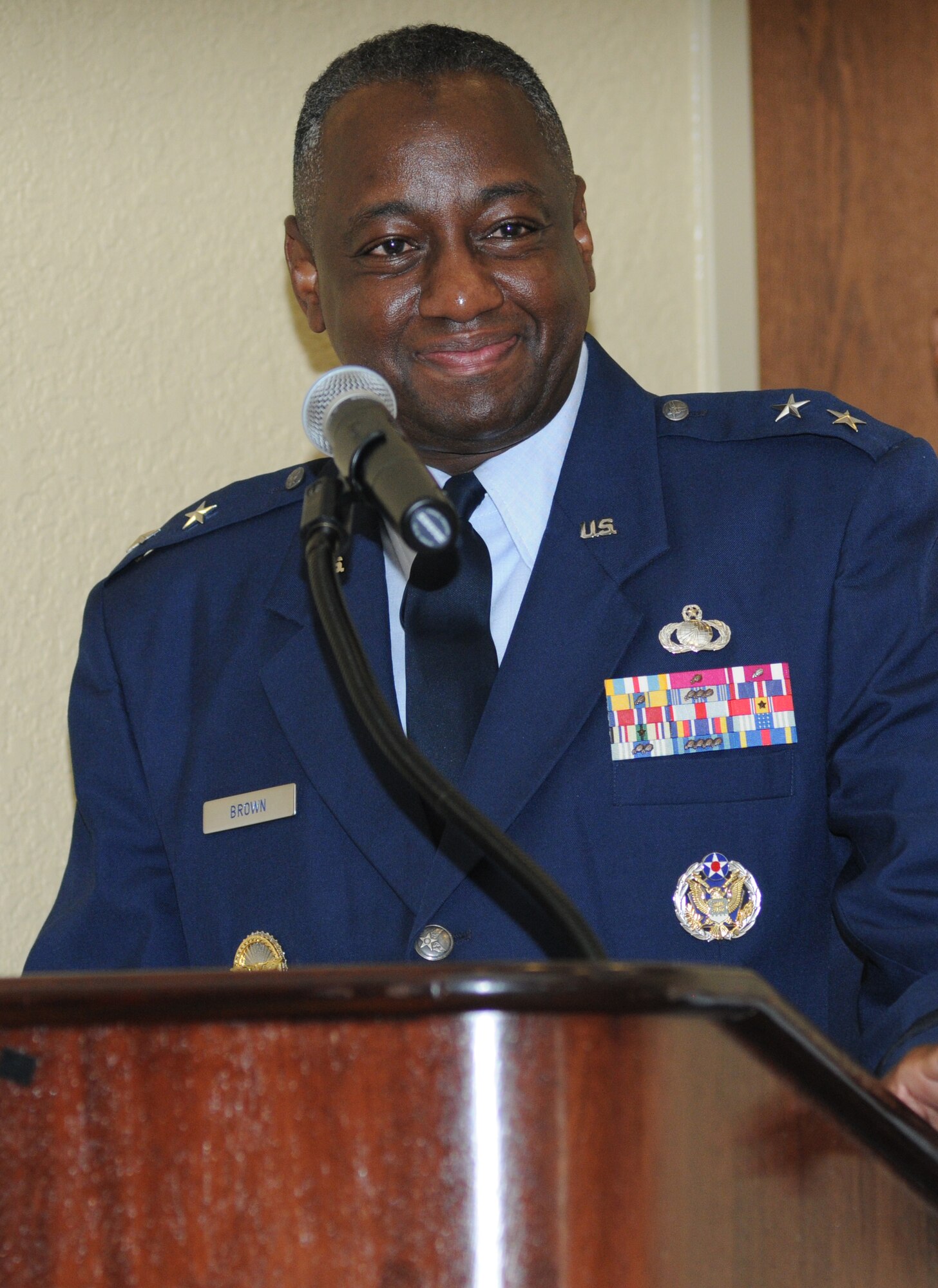 Maj. Gen. Mark Brown, 2nd Air Force commander, provides remarks during his promotion ceremony Sept. 12, 2014, at the Bay Breeze Event Center, Keesler Air Force Base, Miss.  General Robin Rand, Air Education and Training Command commander, was the officiating officer for the event. (U.S. Air Force photo by Kemberly Groue)