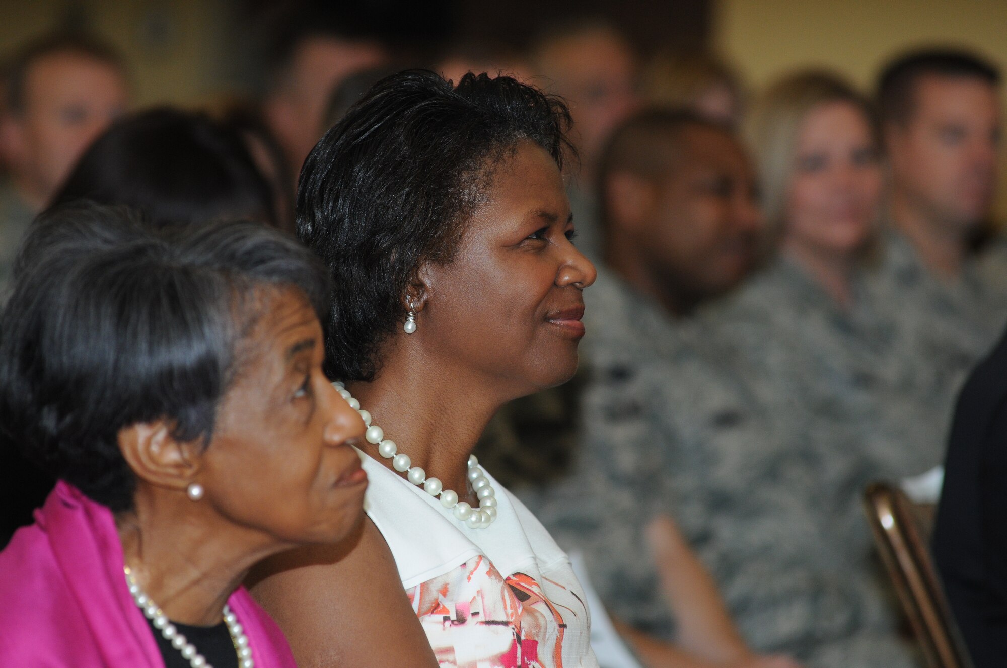 The mother and wife of Maj. Gen. Mark Brown, 2nd Air Force commander, sit in the audience during Brown’s promotion ceremony Sept. 12, 2014, at the Bay Breeze Event Center, Keesler Air Force Base, Miss. General Robin Rand, Air Education and Training Command commander, was the officiating officer for the event. (U.S. Air Force photo by Kemberly Groue)