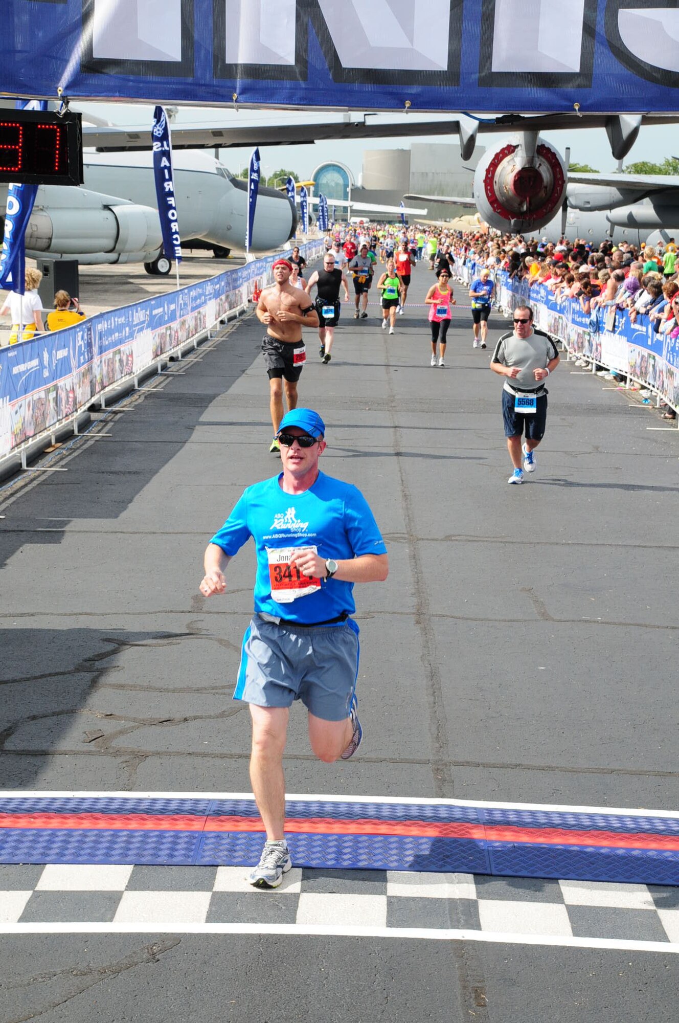 Maj. Jon Phillips, IT enterprise support specialist for the Air Force Inspection Agency, crosses the finish line at the 2012 Air Force marathon.  He will be running in his fifth Air Force marathon Sept. 20. (Courtesy photo)