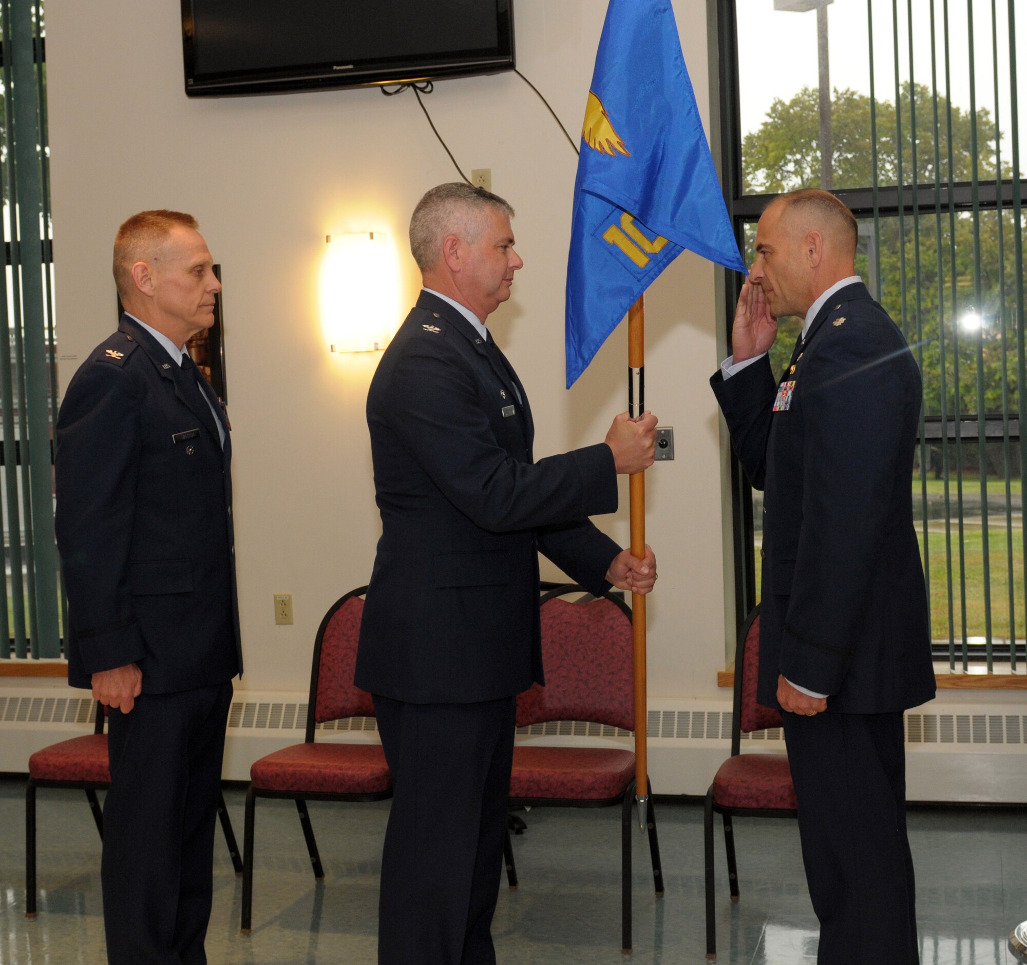 Lt. Col. Jeffrey Hedges (right) assumes command of the 109th Mission Support Group from Col. Shawn Clouthier (center), 109th Airlift Wing commander, during a change of command ceremony Sept. 13, 2014, at Stratton Air National Guard Base, N.Y. Col. Walter Wintsch (left) relinquished command during the ceremony. Hedges served as the 109th Logistics Readiness Squadron commander before taking the position as MSG commander. (U.S. Air National Guard photo by Master Sgt. William Gizara/Released)