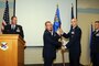 Lt. Col. John Richardson assumes command of the 151st Force Support Squadron from outgoing commander Lt. Col. Mark Roberts during a change of command ceremony held at the Utah Air National Guard Base dining facility on Sept. 14, 2014. (Utah Air National Guard Photo by Staff Sgt. Annie Edwards/RELEASED)