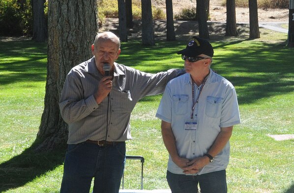 Duane Wolfe, the 92nd U.S. Army Air Forces/U.S. Air Force Memorial Association president, and Daniel Simmons, the vice president of the association, address attendees of the organization’s annual barbecue at Medical Lake, Washington, Sep. 14, 2014. The event was held at Waterfront Park and was an opportunity for veterans from different eras to meet each other. (U.S. Air Force photo/Airman 1st Class Sam Fogleman)