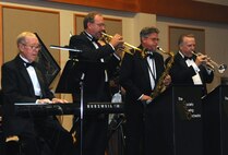 The Society Swing Orchestra provided live music representing compositions spanning the 1930s through the 1960s at the 2014 Air Force Ball Sept. 13. Musical director Jay Constantino on trumpet, center, is a former member of the U.S. Air Force Band. Approximately 340 people attended the event at the Grizzly Bend. (U.S. Air Force photo/Airman 1st Class Joshua Smoot)