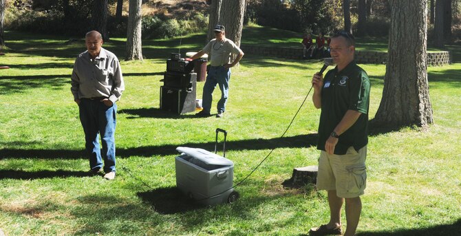 Col. Brian McDaniel, the 92nd Air Refueling Wing commander, addresses attendees of the 92nd U.S. Army Air Forces/U.S. Air Force Memorial Association barbecue at Medical Lake, Washington, Sep. 14, 2014. The event, held at Waterfront Park, was the third annual event for past and present members of the wing. (U.S. Air Force photo/Airman 1st Class Sam Fogleman)