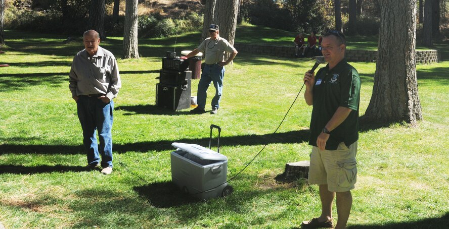 Col. Brian McDaniel, the 92nd Air Refueling Wing commander, addresses attendees of the 92nd U.S. Army Air Forces/U.S. Air Force Memorial Association barbecue at Medical Lake, Washington, Sep. 14, 2014. The event, held at Waterfront Park, was the third annual event for past and present members of the wing. (U.S. Air Force photo/Airman 1st Class Sam Fogleman)