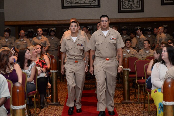Naval Nuclear Power Training Unit Chief Selectees march in formation as they prepare to have their anchors pinned on Sept. 16, 2014, at the Redbank Club on Joint Base Charleston, S.C. The pinning ceremony marks the culmination of hard work and dedicated service, and begins the next step of their Navy career as deckplate leaders. (U.S. Air Force photo/Eric Sesit)