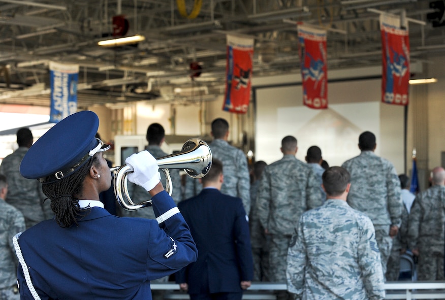 Airman 1st Class Angela Lambert, 4th Fighter Wing Honor Guard, plays taps on the bugle during the 9/11 Remembrance Ceremony at Seymour Johnson Air Force Base, North Carolina, Sep. 11. The event, hosted by the 4th FW Honor Guard, 4th Civil Engineer Squadron and the 4th Security Forces Squadron, featured narrators recounting the sequence of events on 9/11, a firing party, and moments of silent reflection, paying homage to the lives lost on 9/11. (U.S. Air Force photo/Airman 1st Class Aaron Jenne)