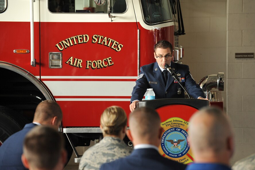 Tech. Sgt. Brandon Sanderson, 4th Civil Engineer Squadron Fire Department, recounts the sequence of events on 9/11 during the 9/11 Remembrance Ceremony at Seymour Johnson Air Force Base, North Carolina, Sep. 11. The event, hosted by the 4th Fighter Wing Honor Guard, 4th Civil Engineer Squadron and the 4th Security Forces Squadron, also featured a firing party, and moments of silent reflection, paying homage to the lives lost on 9/11. In conjunction with the ceremony, the base held a 24-hour 9/11 Remembrance Run. (U.S. Air Force photo/Airman 1st Class Aaron Jenne)
