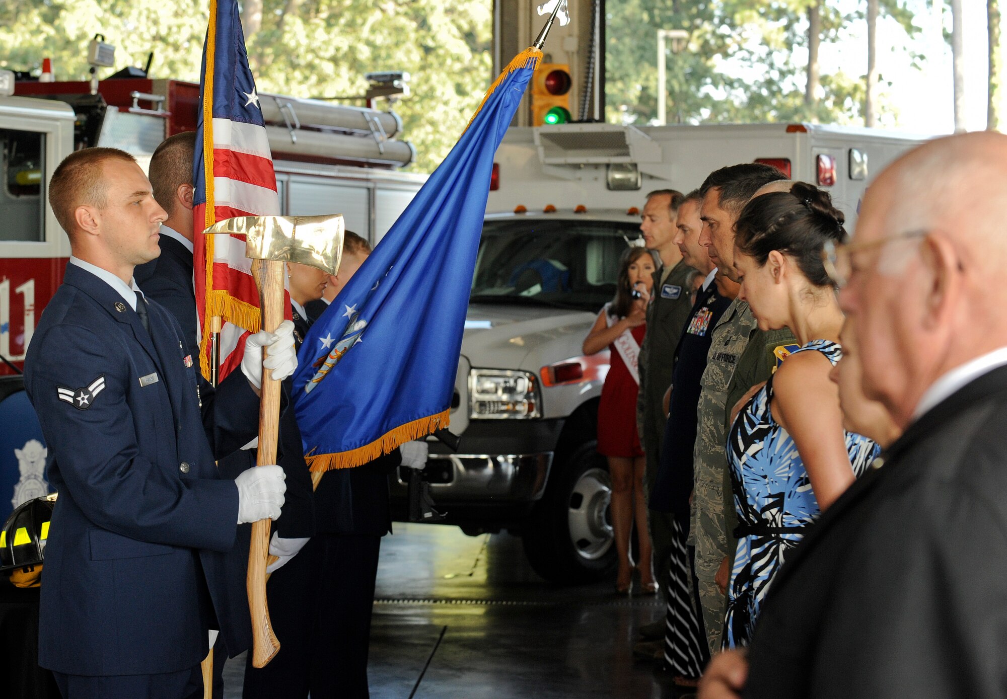 Airmen assigned to the 4th Civil Engineer Squadron present the colors during the 9/11 Remembrance Ceremony at Seymour Johnson Air Force Base, North Carolina, Sep. 11. The event, hosted by the 4th Fighter Wing Honor Guard, 4th Civil Engineer Squadron and the 4th Security Forces Squadron, featured narrators recounting the sequence of events on 9/11, a firing party, and moments of silent reflection, paying homage to the lives lost on 9/11. (U.S. Air Force photo/Airman 1st Class Aaron Jenne)