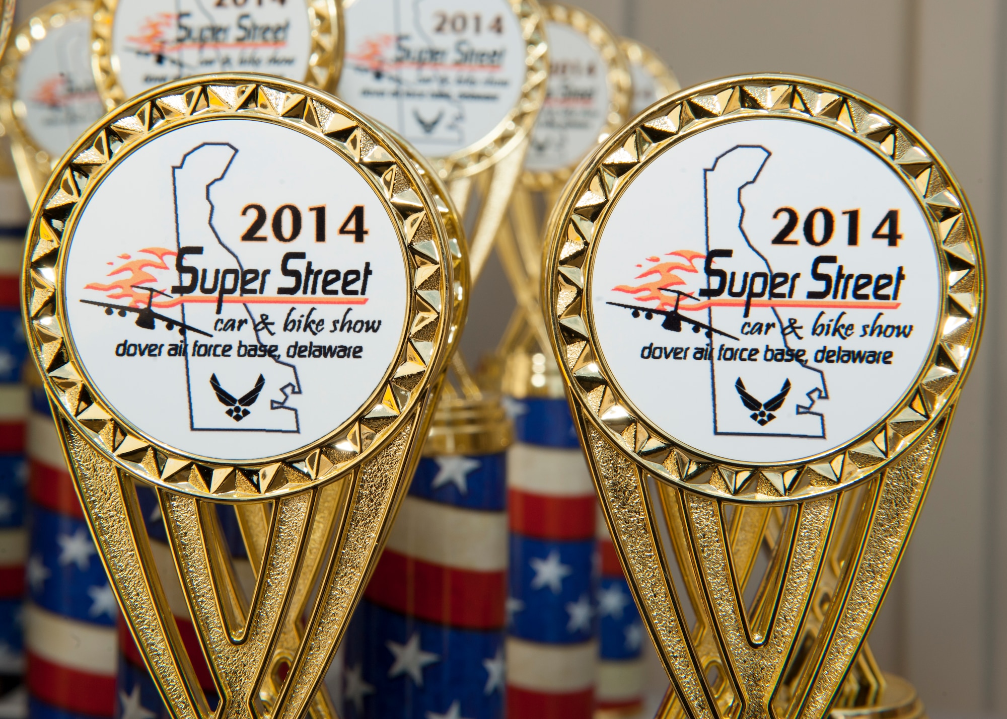 Competition trophies sit on display at the 2014 Super Street car and bike show Sept. 14, 2014, at the Air Mobility Command Museum on Dover Air Force Base, Del. There were several different categories of competition at the event. (U.S. Air Force photo/Airman 1st Class Zachary Cacicia) 