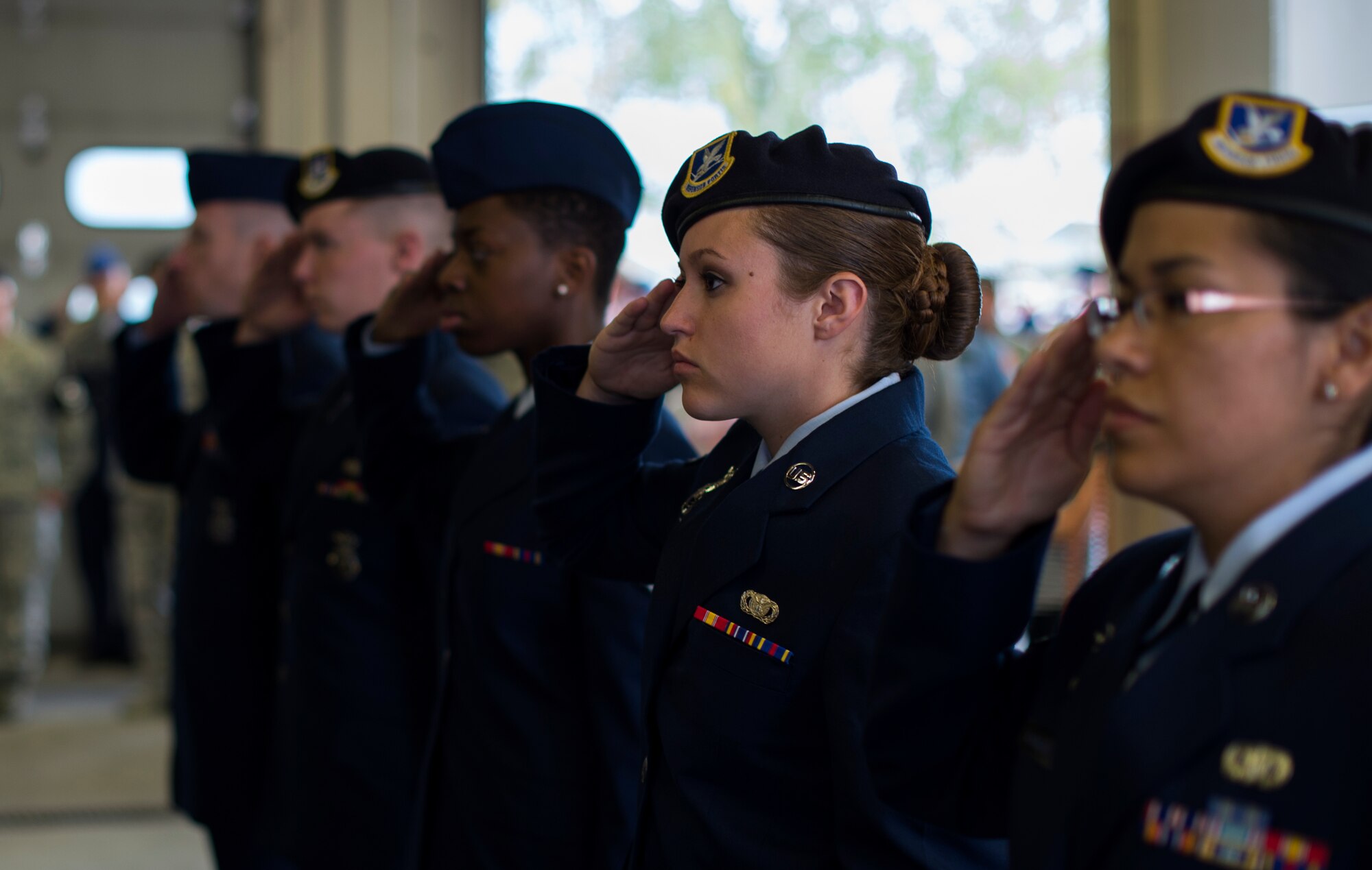 Members of Team Ramstein render a salute during a 9/11 ceremony at Fire Station One on Ramstein Air Base, Germany, Sept. 11, 2014. The ceremony was held to honor the first responders who lost their lives at the World Trade Center 13 years ago. (U.S. Air Force photo/Senior Airman Damon Kasberg)