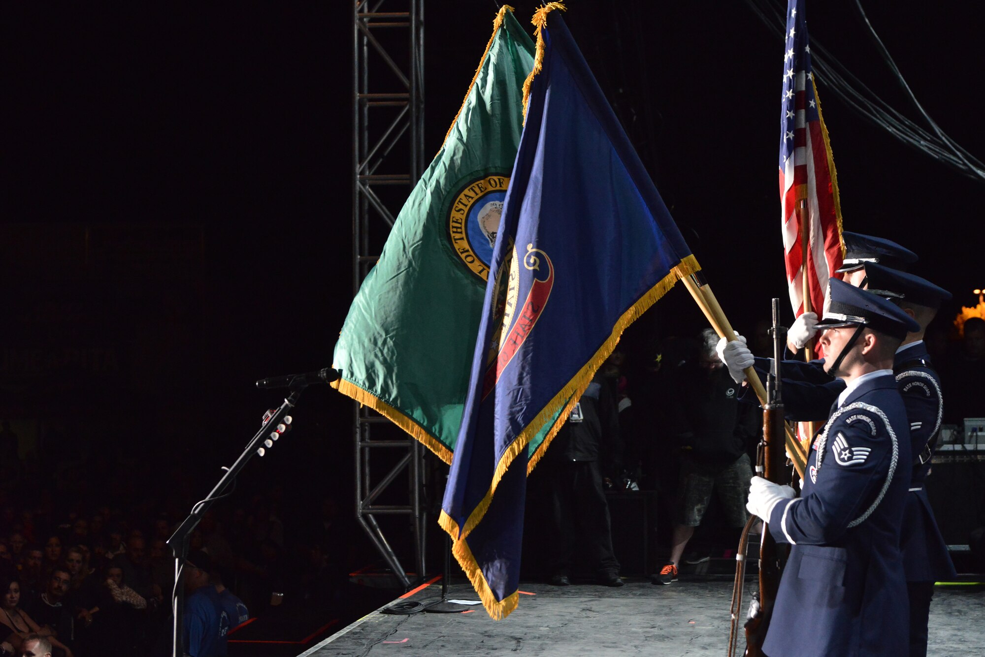 Members from the Fairchild Air Force Base honor guard present the colors on stage for thousands of fans during the “Rock Hard at the Park” concert tour Sept. 11, 2014, in Post Falls, Idaho. The concert highlighted multiple rock bands and had a special patriotic ceremony to highlight Sept. 11. (U.S. Air Force photos by Staff Sgt. Alexandre Montes/Released)
