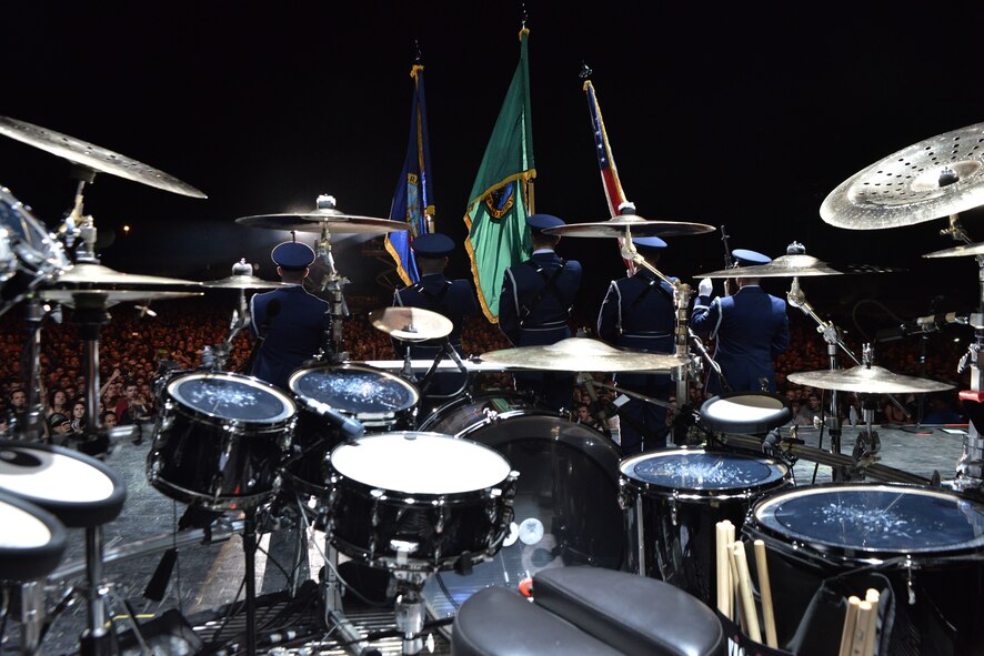 Members from the Fairchild Air Force Base honor guard present the colors on stage for thousands of fans during the “Rock Hard at the Park” concert tour Sept. 11, 2014, in Post Falls, Idaho. The concert highlighted multiple rock bands and had a special patriotic ceremony to highlight Sept. 11. (U.S. Air Force photos by Staff Sgt. Alexandre Montes/Released)