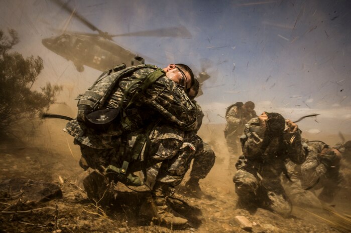 FORT IRWIN, Calif. - U.S. Army Soldier's assigned to the 3rd Squadron 17th Regiment are picked up by a blackhawk helicopter after participating in a SERE exercise during Decisive Action Rotation 14-09 at the National Training Center, Aug. 13, 2014. Decisive action rotations are reflective of the complexities of potential adversaries our nation could face and include: guerilla, insurgent, criminal and near-peer conventional forces woven into one dynamic environment. (U.S. Air Force Photo by Staff Sgt. Corey Hook/Released)