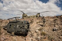 FORT IRWIN, Calif. – U.S. Army Lt. Jeff Frantz, 3rd Squadron 17th Regiment Delta company apache pilot, participates in a sling load exercise during Decisive Action Rotation 14-09 at the National Training Center, Aug. 10, 2014. Decisive action rotations are reflective of the complexities of potential adversaries our nation could face and include: guerilla, insurgent, criminal and near-peer conventional forces woven into one dynamic environment. (U.S. Air Force Photo by Staff Sgt. Corey Hook/Released)
