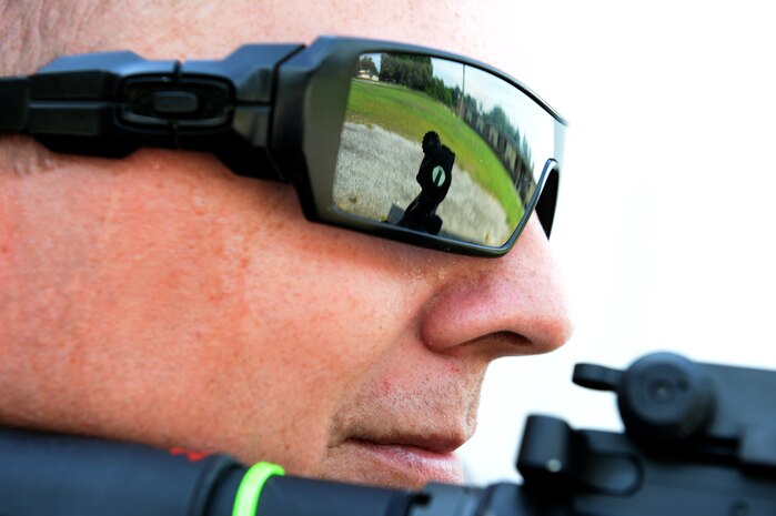 U. S. Air Force Senior Airman Rion Ehrman, a combat broadcaster with the 1st Combat Camera Squadron, looks for threats while taking the lead of his group during weapons tactics training, June 5, 2014, Bowman, S.C.  Airmen with 1 CTCS practice weapons manipulation skills often to keep a combat readiness mindset at all times. (U.S. Air Force photo by Senior Airman Logan Brandt/released)