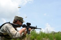 U.S. Air Force Tech. Sgt. Michael Carlson, a combat cyber transport technician with the 1st Combat Camera Squadron, fires the M4 carbine at paper targets during weapons tactics training, June 3, 2014, Bowman, S.C. Airmen with 1 CTCS practice weapons manipulation skills often to keep a combat readiness mindset at all times. (U.S. Air Force photo by Senior Airman Logan Brandt/released)