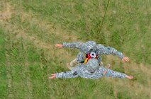 Members of Joint Task Force Aviation hoist soldiers into a UH-60 Blackhawk during exercise Vibrant Response 14 at Camp Atterbury, Ind., July 26, 2014. Vibrant Response is a Defense Chemical, Biological, Radiological, and Nuclear Response Force (DCRF) training event. The exercise focuses on Department of Defense support of civil authorities in a consequence management role. The DCRF is part of DoD's scalable response capability to assist civilian responders in saving lives, relieving human suffering and providing critical support community recovery following a catastrophic CBRN incident. (U.S. Air Force photo by Senior Airman Jasmonet Jackson/ Released)