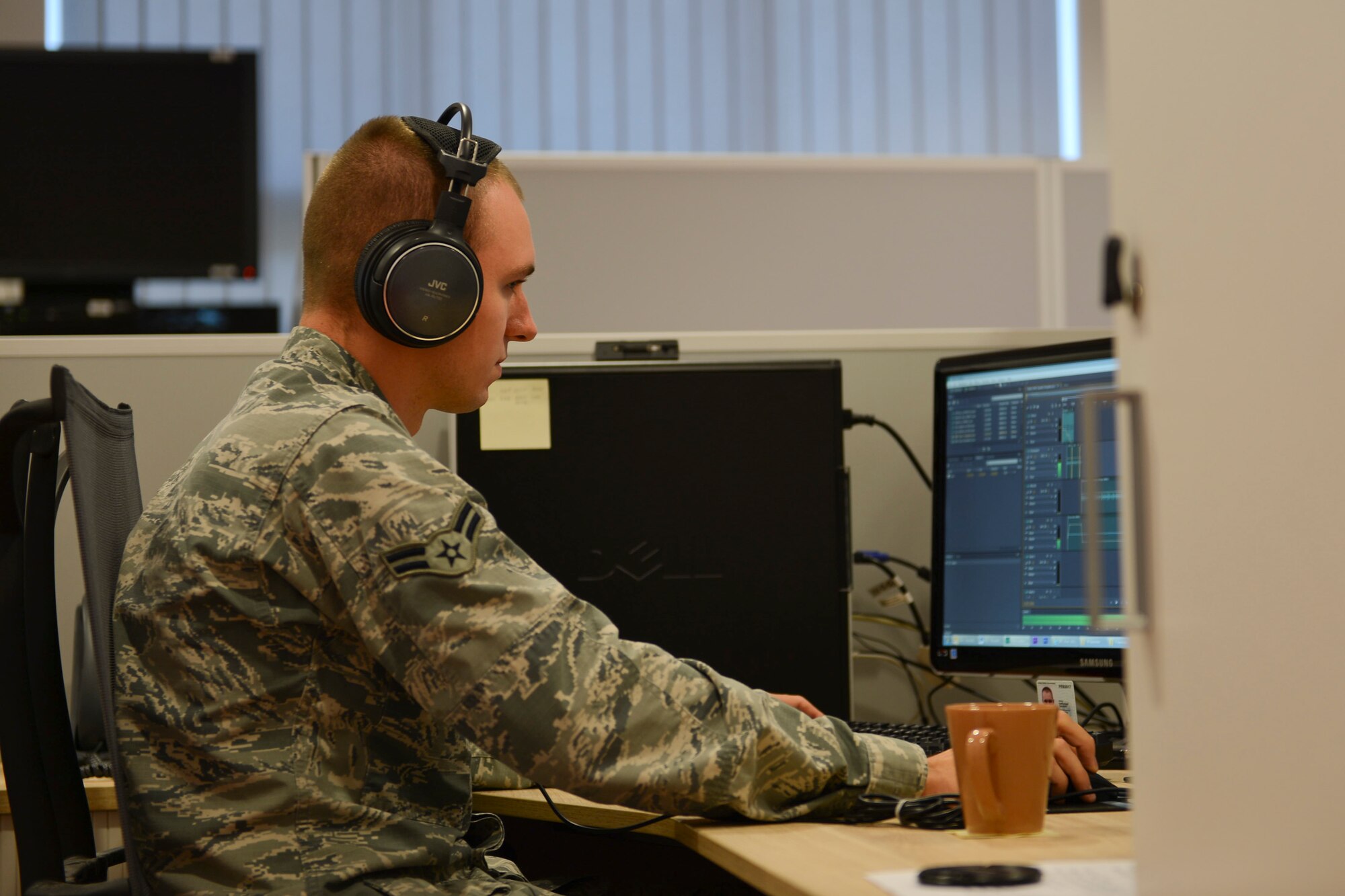 Senior Airman Ben Burgess, American Forces Network Kaiserslautern broadcast journalist, edits video footage on Vogelweh Military Complex, Sept. 10, 2014. The American Forces Network, Kaiserslautern, has been providing service to military members since 1954 while bringing with them a taste of home. (U.S. Air Force photo/Airman 1st Class Michael Stuart) (U.S. Air Force photo/Airman 1st Class Michael Stuart)