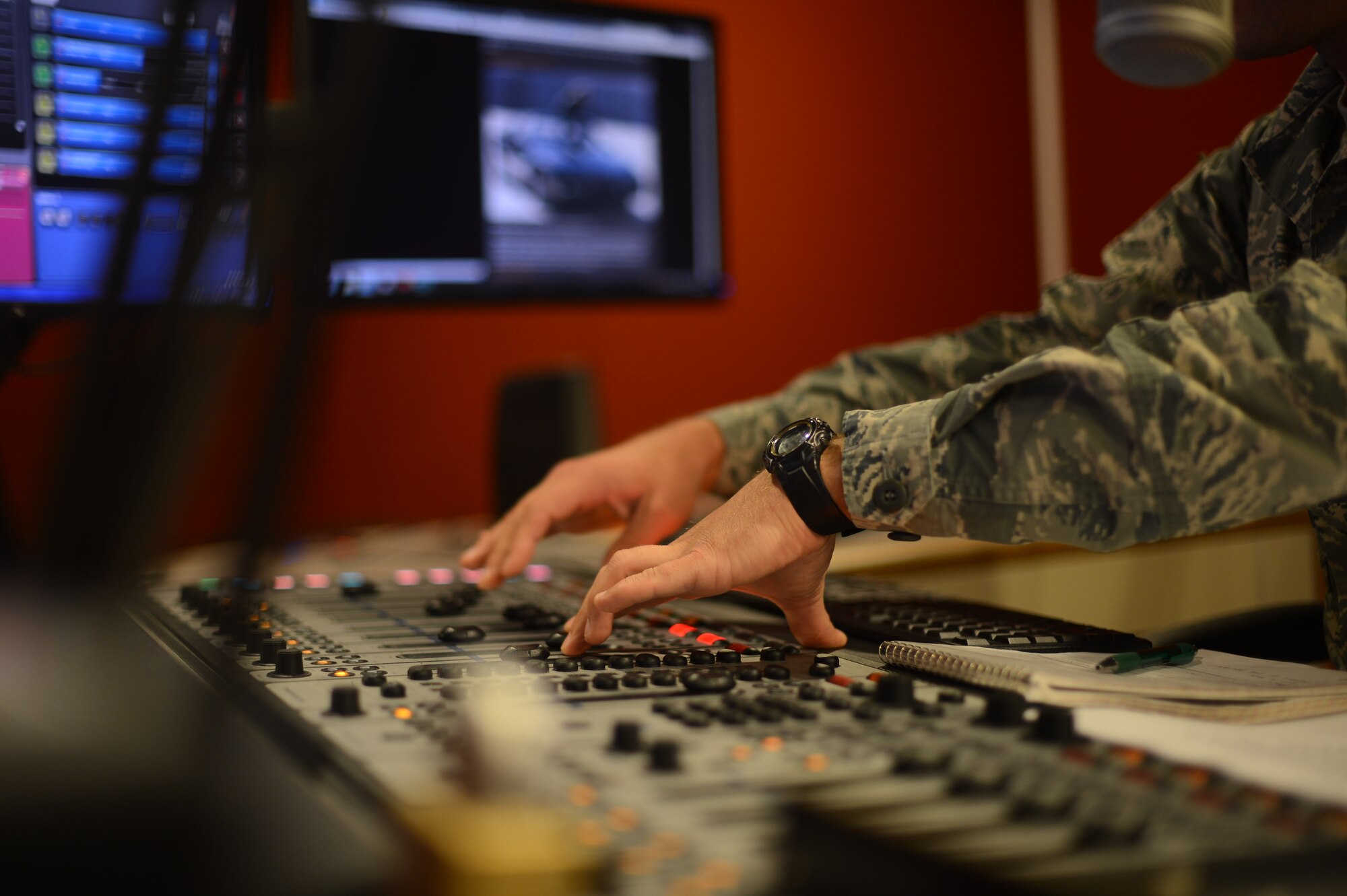 Senior Airman Eli Smith, American Forces Network Kaiserslautern broadcast journalist, DJs a radio morning show on Vogelweh Military Complex, Sept. 10, 2014. The American Forces Network, Kaiserslautern, has been providing service to military members since 1954 while bringing with them a taste of home. (U.S. Air Force photo/Airman 1st Class Michael Stuart)