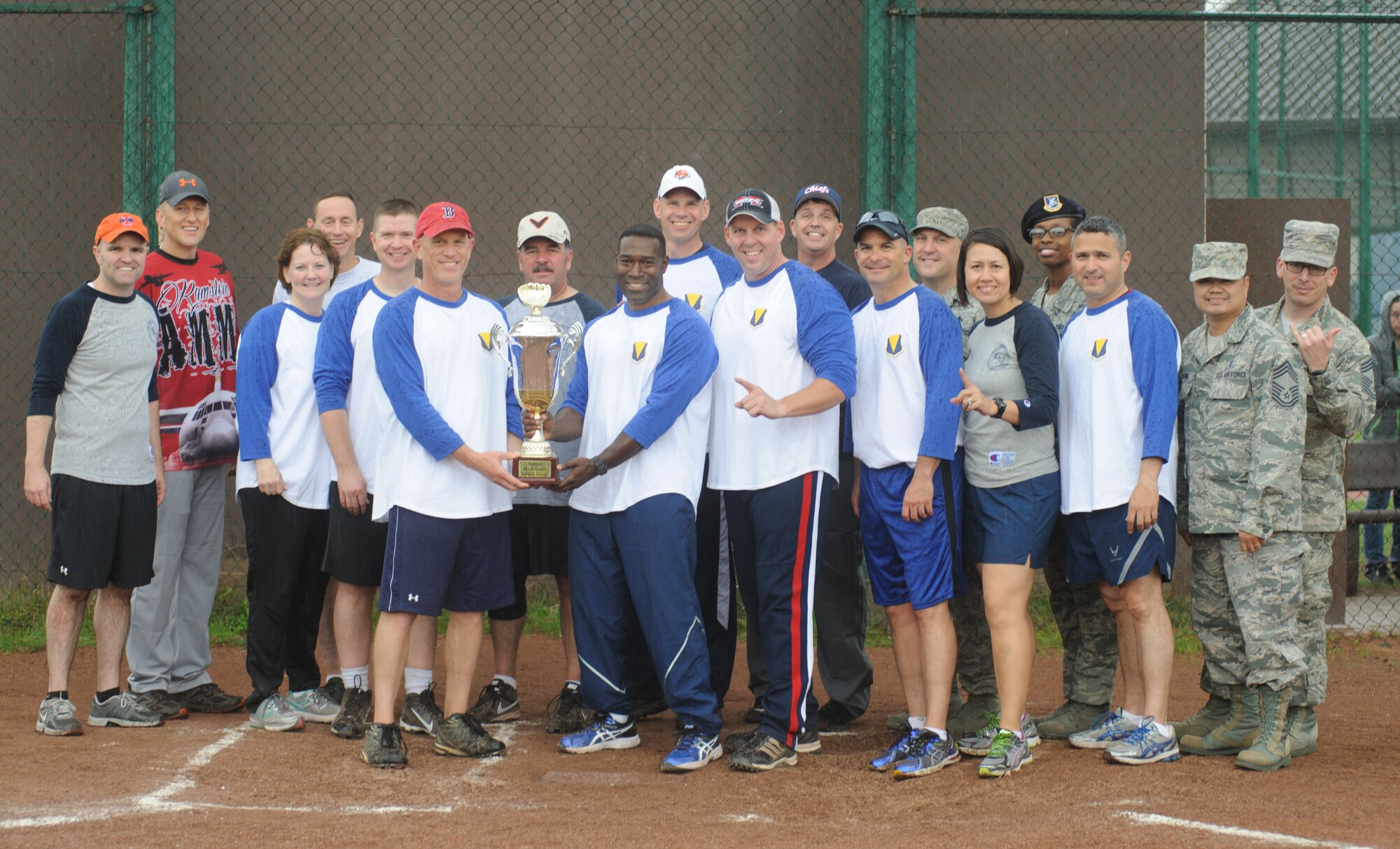 The chief team poses with their trophy after beating the eagles 10-7 during the RUfit Resilience Day softball game Sept. 11, 2014 at Ramstein Air Base, Germany. The game was the final event of the day designed to improve morale, fitness and resiliency. (U.S. Air Force photo/ Senior Airman Timothy Moore) 