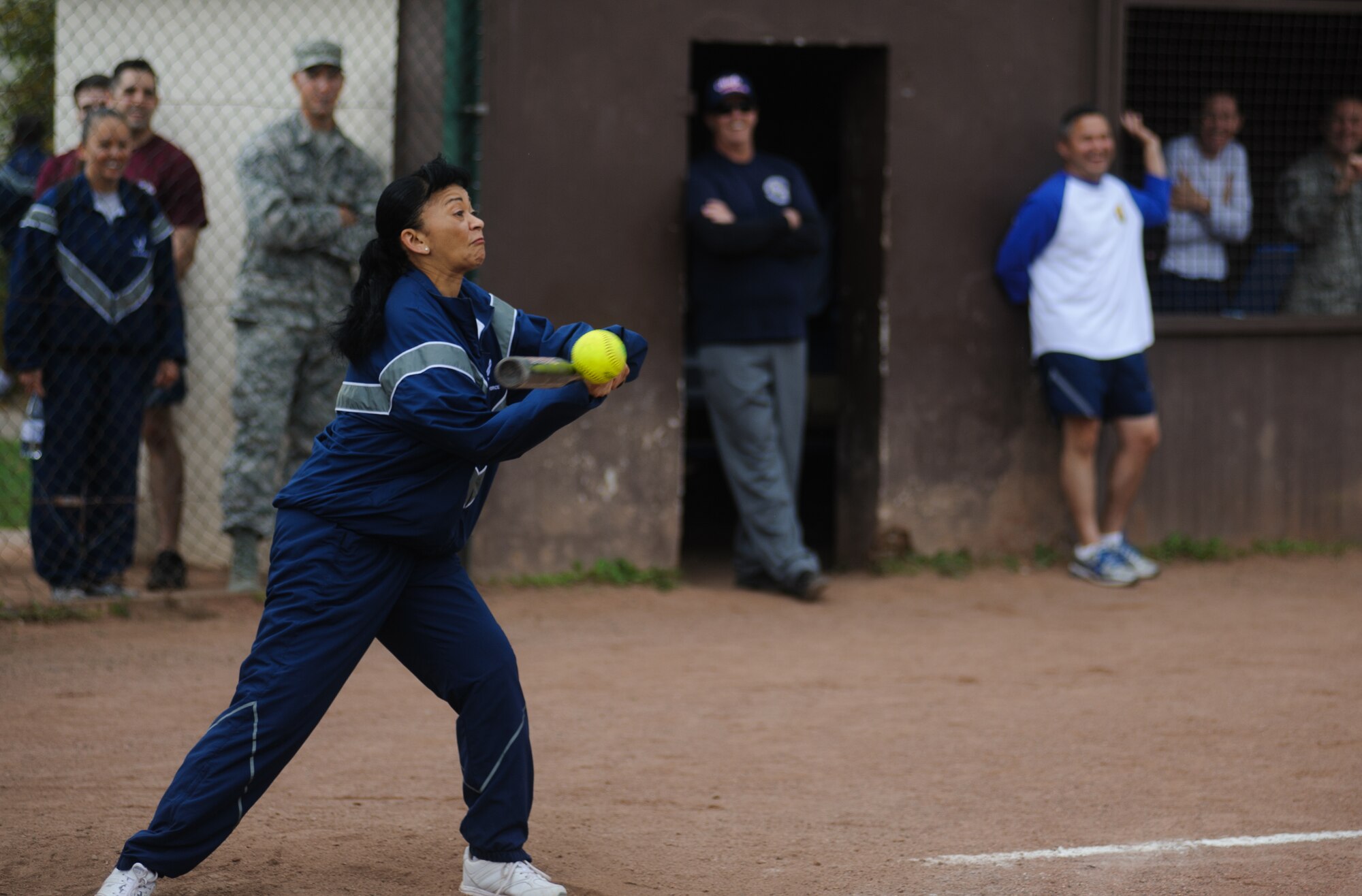 Col. Christine Taylor, 86th Medical Group commander, hits the ball as the eagles attempt to catch up to the eagles during their softball game Sep. 11, 2014 at Ramstein Air Base, Germany. The chiefs won the game 10-7. (U.S. Air Force photo/ Senior Airman Jonathan Stefanko)