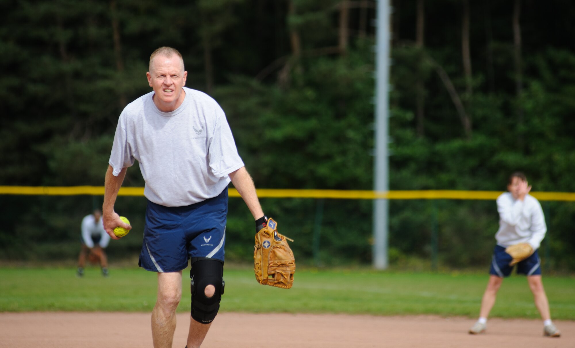 Col. Charles Stock, 86th Dental Squadron eagles’ pitcher, throws a ball at a chief during their game Sep. 12, 2014 at Ramstein Air Base, Germany. The game gave Airmen an opportunity to see a lighter side of their leadership. (U.S. Air Force photo/ Senior Airman Jonathan Stefanko)