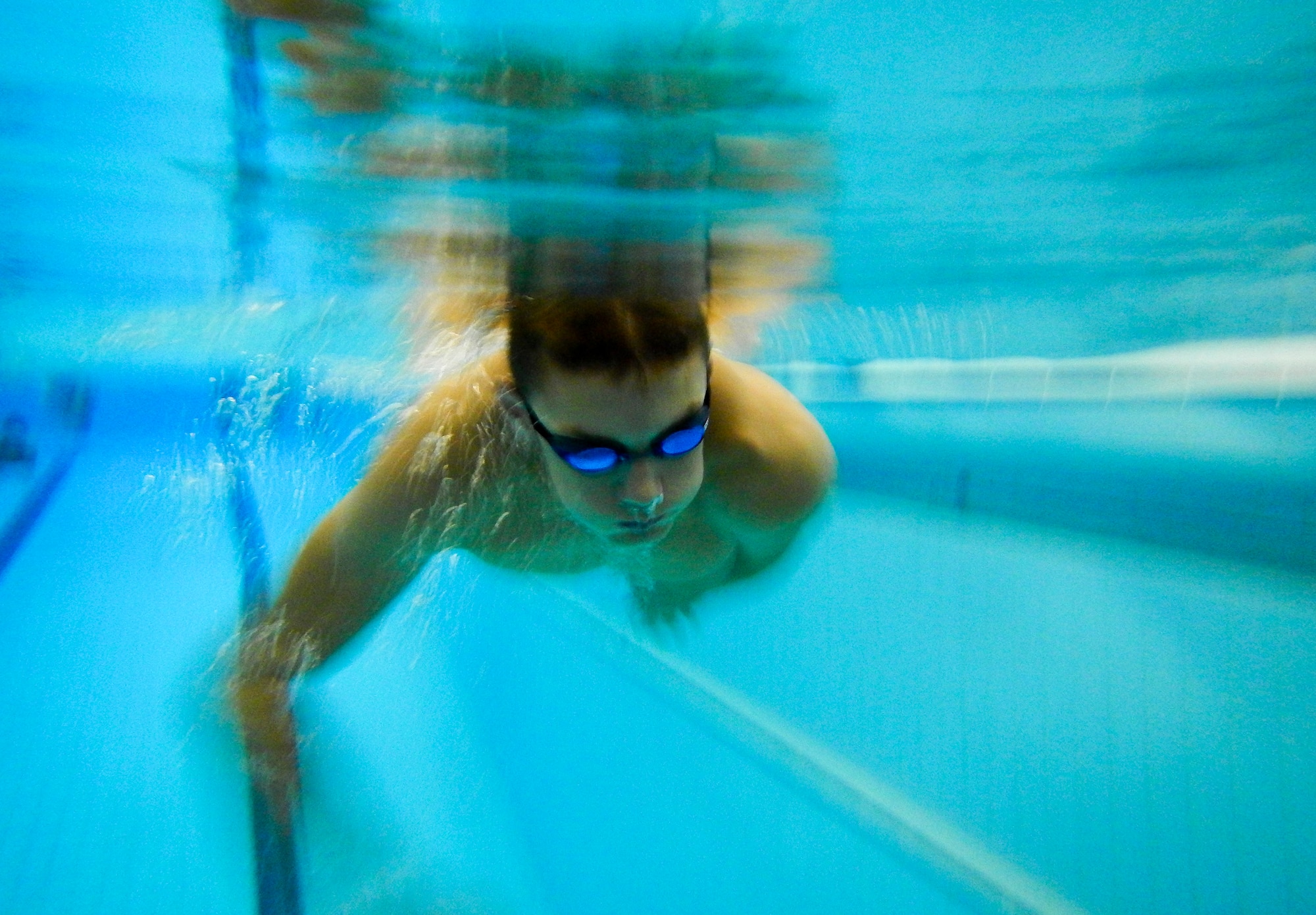 A swimmer from the Lakenheath Barracudas swim team performs swimming techniques during practice at Royal Air Force Honington, England, Sept. 4, 2014. The European Forces Swim League is comprised of American and British swimmers who attend weekly practices and compete against other EFSL teams around the European region. (U.S. Air Force photo by Airman 1st Class Erin O’Shea/Released)