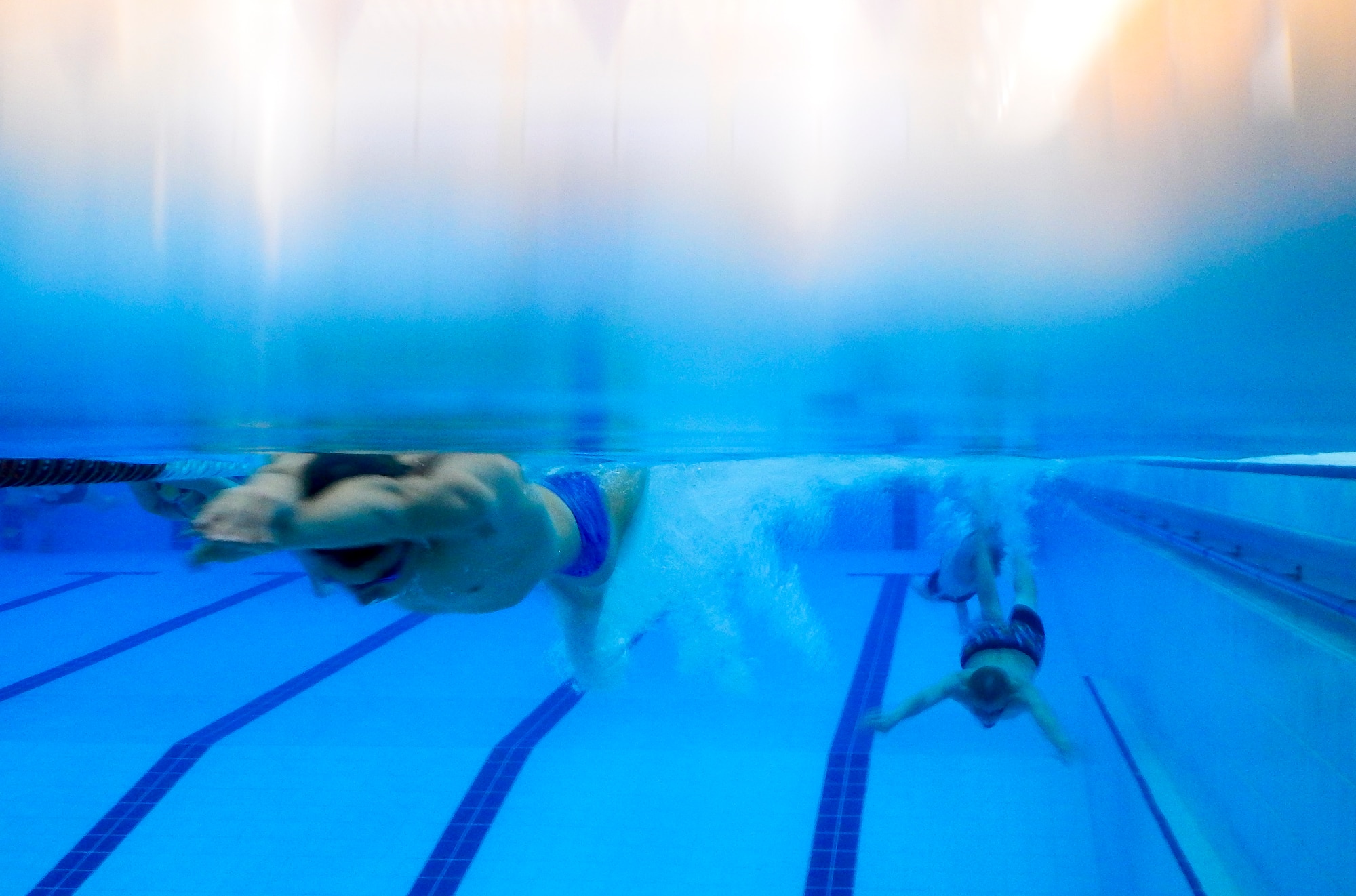 Swimmers from the Lakenheath Barracudas swim team practice various swimming styles during practice at Royal Air Force Honington, England, Sept. 4, 2014. The team includes 35 British and American swimmers who practice weekly, and are provided the opportunity to experience new cultures as they compete around the European region. (U.S. Air Force photo by Airman 1st Class Erin O’Shea/Released) 