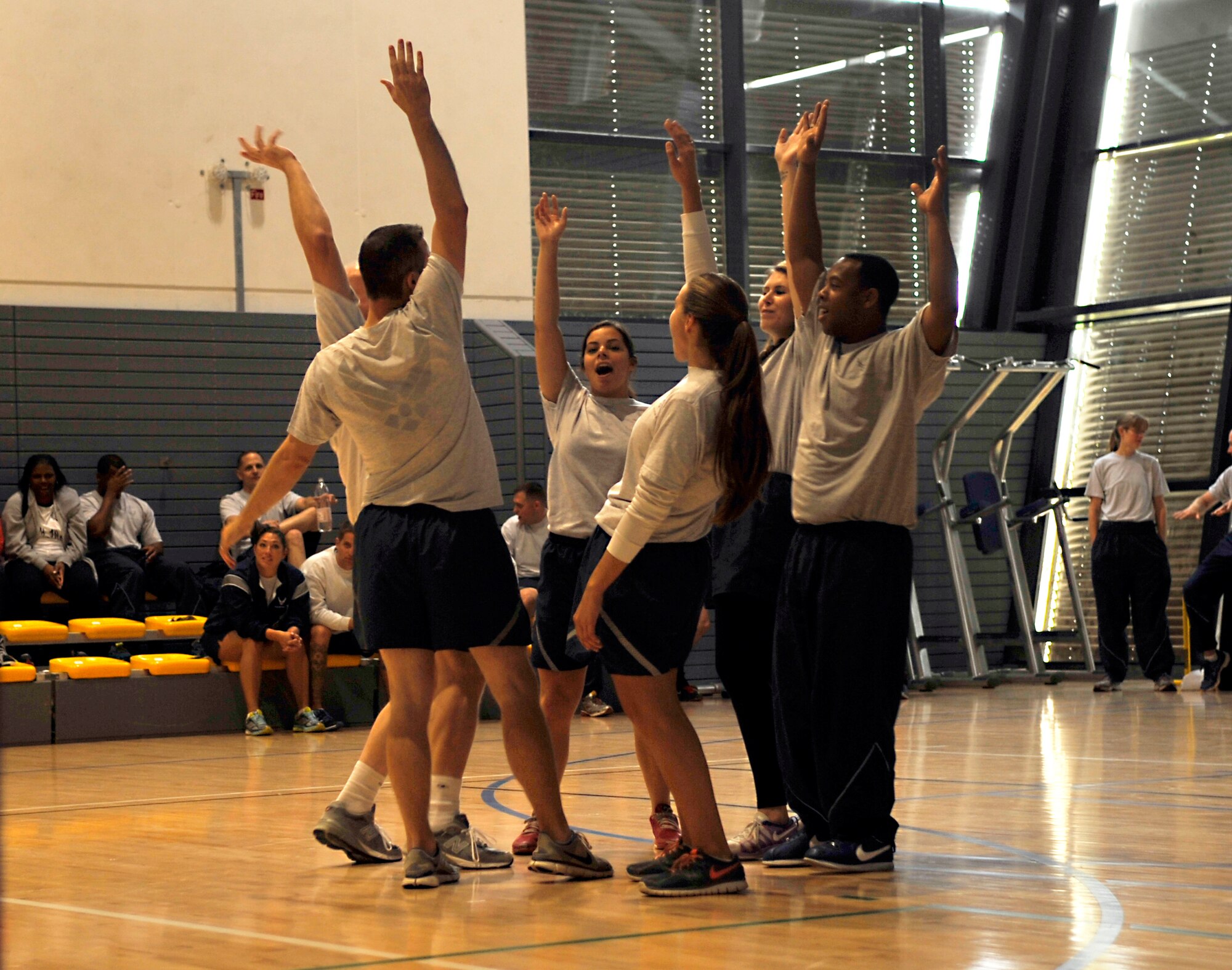 The 86th Dental Squadron break a huddle after winning their volleyball match during Resilience Day on Sept. 11, 2014 at Ramstein Air Base, Germany. The 86th DS received the Commander’s Challenge trophy at the end of the day for winning the most events. (U.S. Air Force photo/Airman Larissa Greatwood)