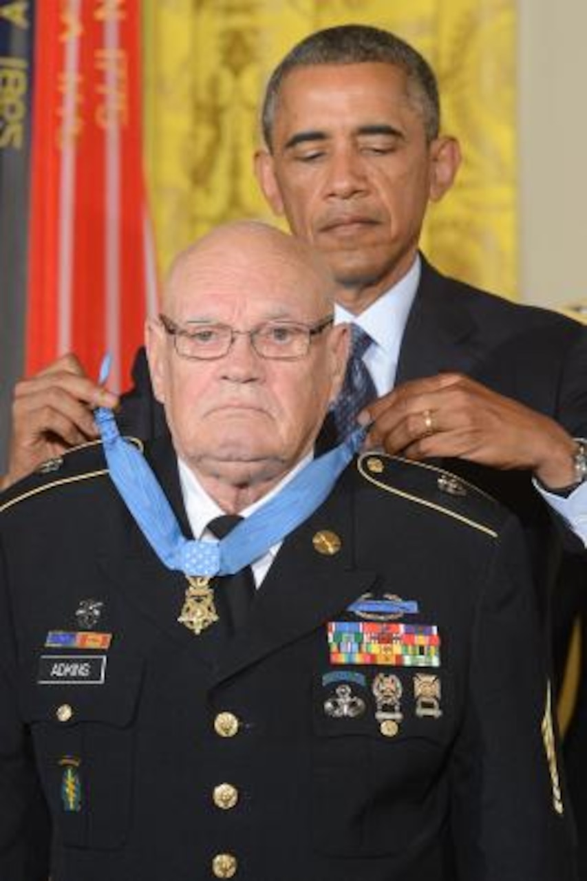 President Barack Obama awards Army Command Sgt. Maj. Bennie G. Adkins the Medal of Honor during a White House ceremony in Washington, D.C., Sept. 15, 2014. DoD News photo by E.J. Hersom